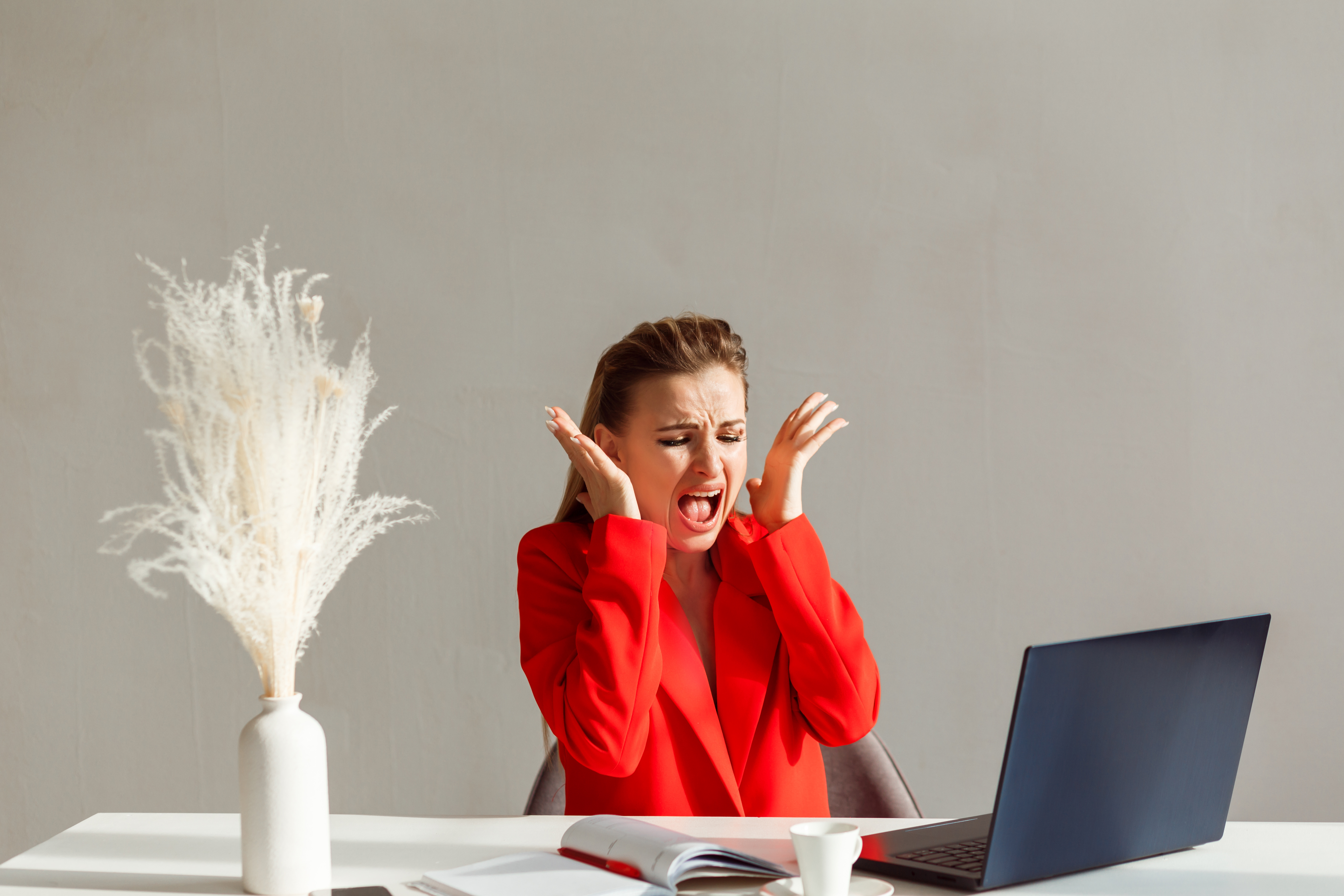 nervous-woman-red-suit-is-screaming-looking-laptop-monitor-woman-stress-work